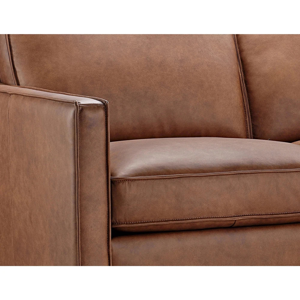 The Frisco Sofa is 100% top grain leather and ideal for modern or western home decors. Its hardwood frame and pocketed coil seating ensure long-lasting durability and comfort. With a square arm and sleek design, this sofa provides a stylish addition to any living space.