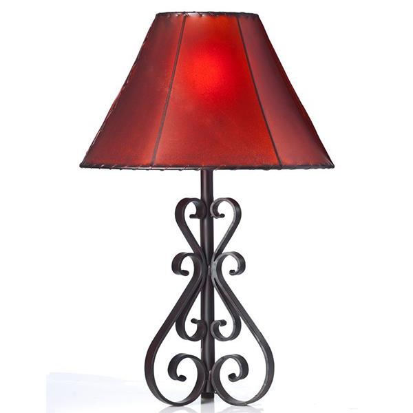 Make a bold statement in your home with this unique hand forged iron table lamp. Its rustic, timeless design is sure to capture any guest's attention. Its durable metal construction is built to last, providing years of reliable illumination.