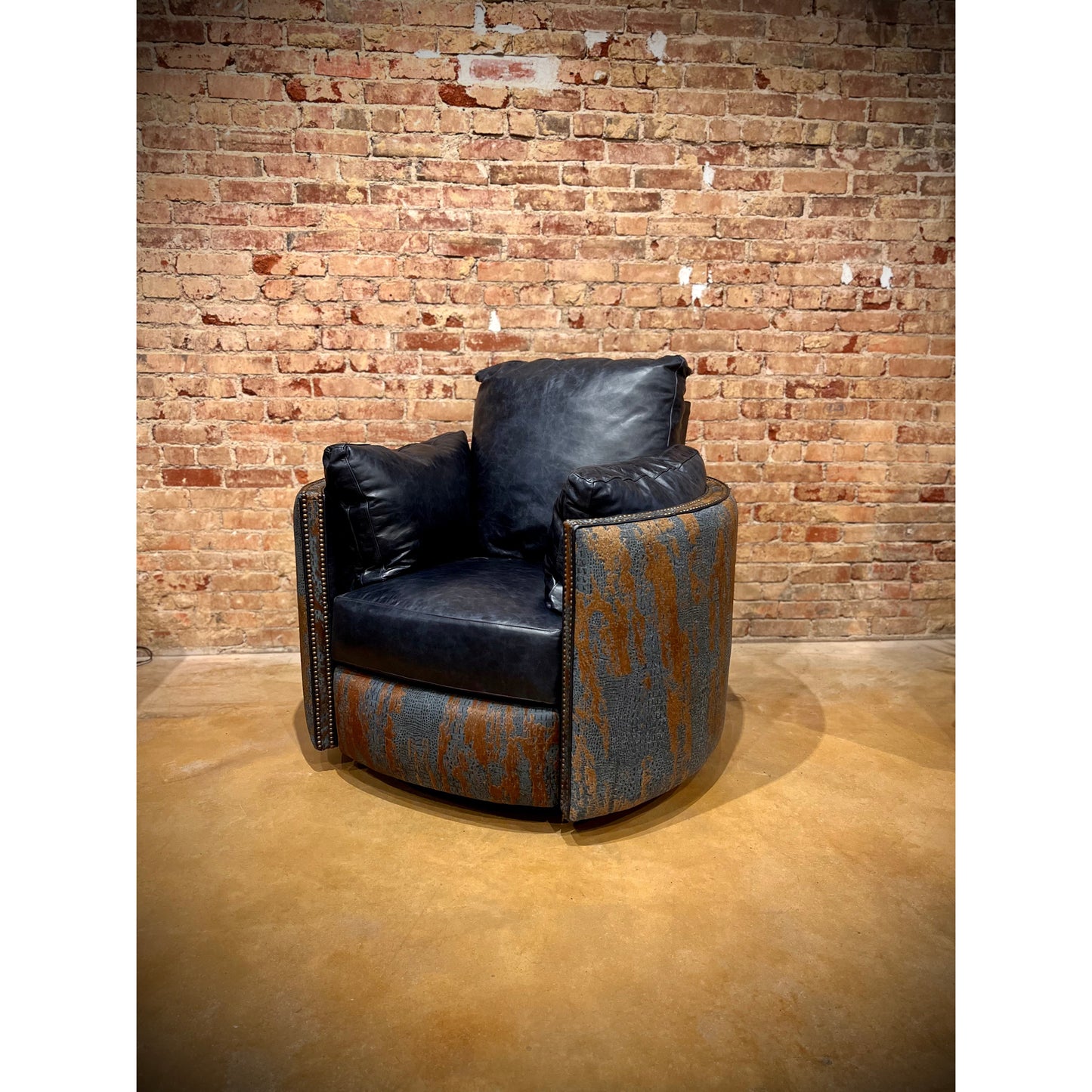 Experience ultimate comfort with our Blue Croc Leather Acid Wash Cowhide Cuddler Recliner. The top grain leather offers luxurious softness, while the swivel feature allows for easy movement. Its unique blue acid wash cowhide design adds a stylish touch to any space. Relax and unwind in the most comfortable recliner you'll ever own.    Handcrafted in Texas. Ships in approxiimately 4 to 6 weeks.