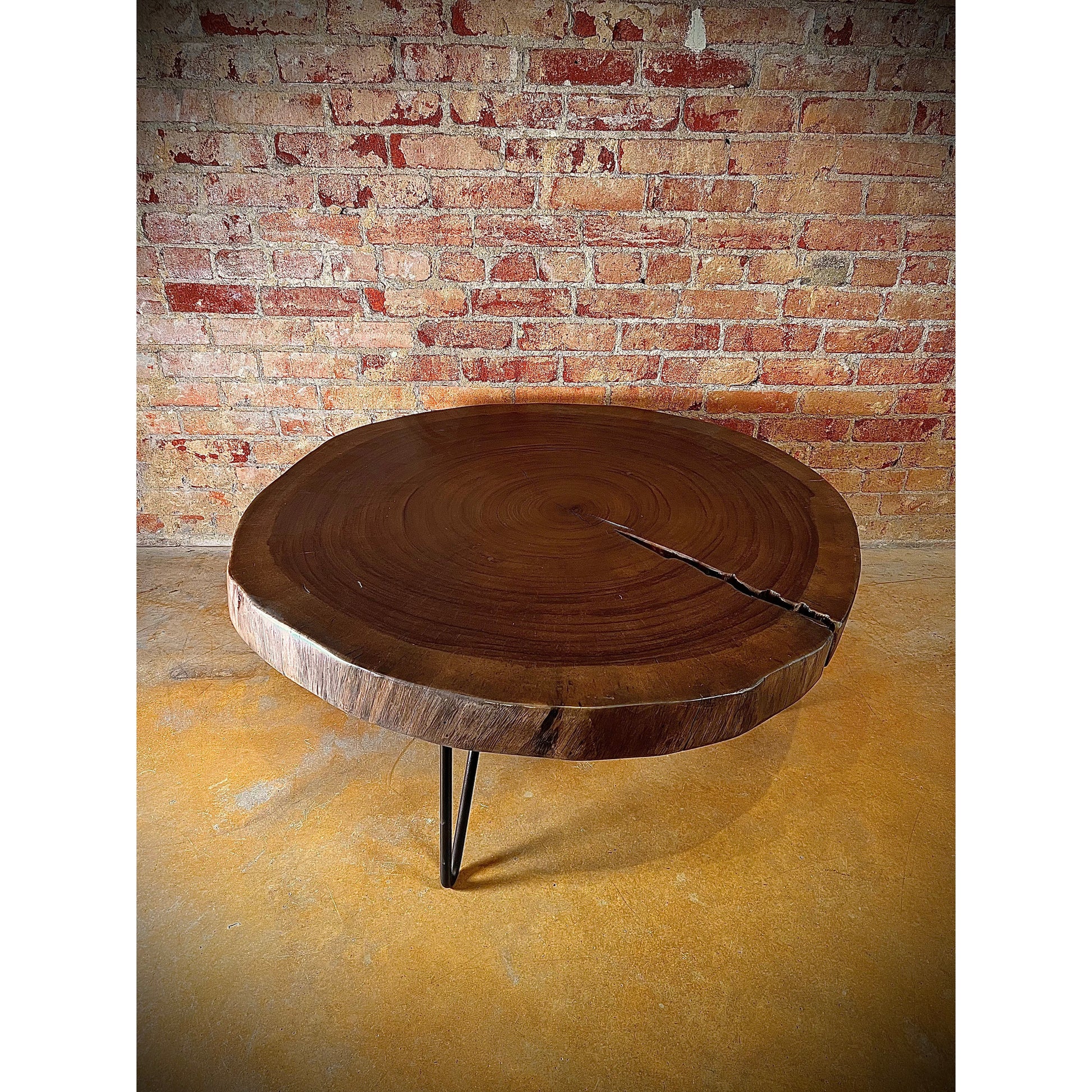 Elevate your living space with our Costa Parota Wood Coffee Table. Crafted with a sturdy iron base and a gorgeous parota wood top, this table brings a touch of nature into any room. With its live edge design, each piece is truly one-of-a-kind. Experience the beauty and durability of parota wood.    Ships in approximately 4 weeks.