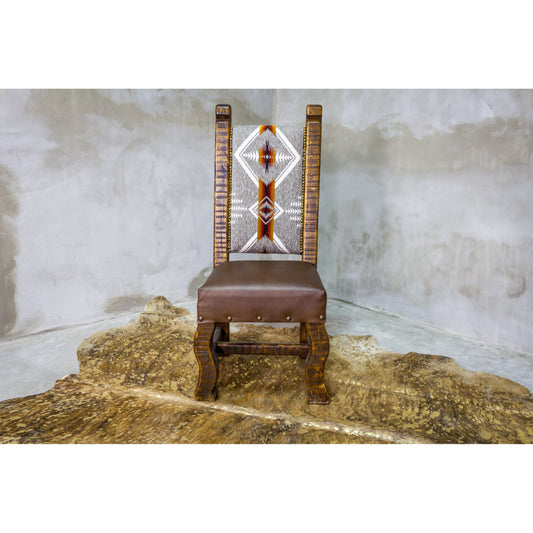 The Old Fashion Navajo Dining Chair adds rustic elegance to any home with its premium southwest upholstery and reclaimed wood construction. Enjoy its quality craftsmanship for a comfortable and unique seating experience.