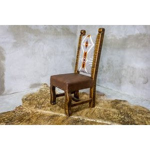 The Old Fashion Navajo Dining Chair adds rustic elegance to any home with its premium southwest upholstery and reclaimed wood construction. Enjoy its quality craftsmanship for a comfortable and unique seating experience.