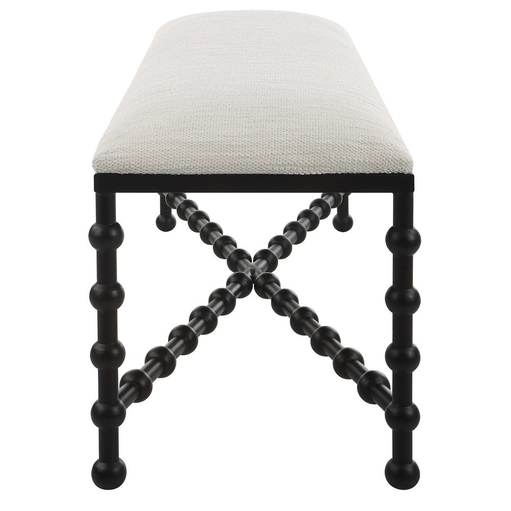 This Iron Drops Bench elevates your home decor with its sophisticated style and bubble legs. Crafted from iron and finished in a satin black, it is contrasted with a white polyester fabric seat, featuring a performance treatment for added durability. Perfect for any living room or entryway.