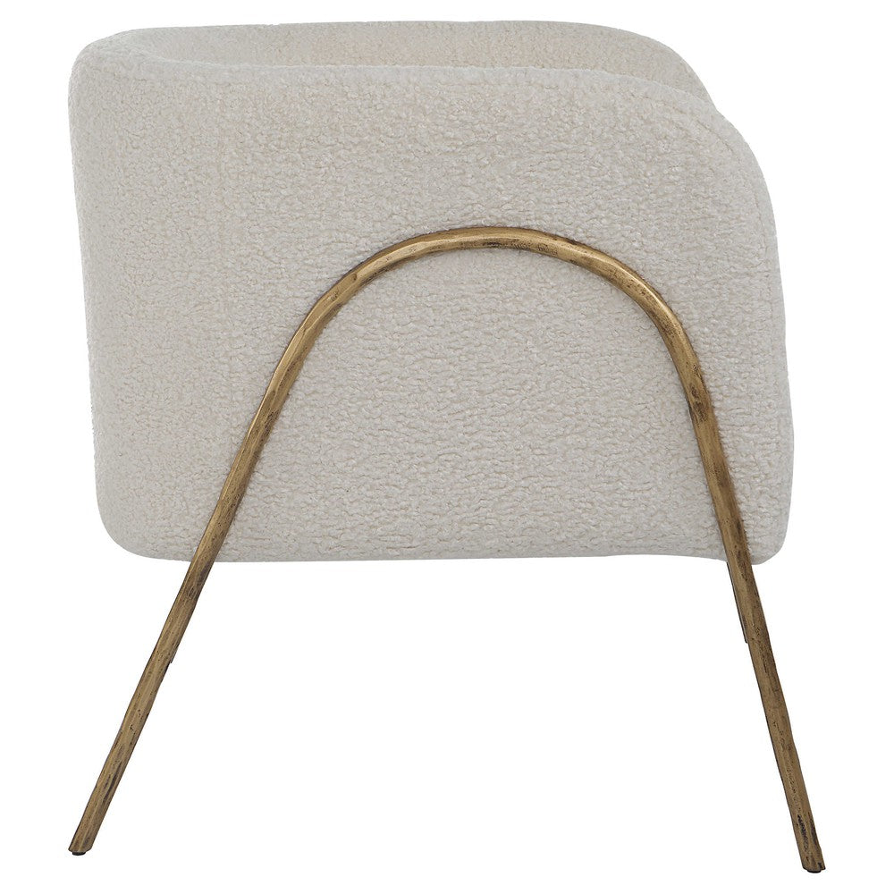 Introduce artful style to your home with the Jacobsen Accent Chair. Boasting an inspired Scandinavian design, the chair boasts an exquisite curved, aged gold finished iron frame and a luxurious off-white faux shearling seat, creating a timeless look to suit any living space. The perfect seat for curling up in, the chair is complete with a 19" seat height.