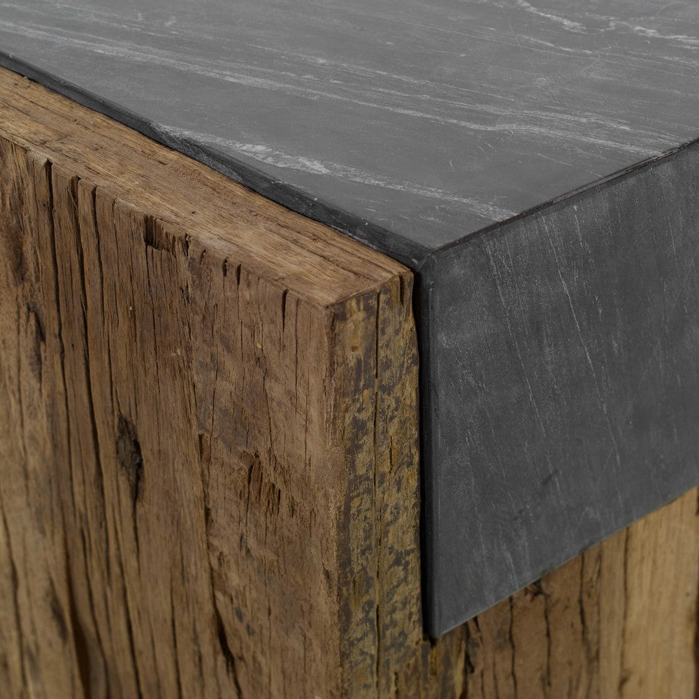 The Jonah Side Table is a unique fusion of rustic and refined. Crafted from naturally-stained reclaimed pine and topped with honed black marble, this piece is sure to add character to any room. Its variegated marbling and veining give it a truly distinctive look, while its solid wood construction ensures a lifetime of stability that will only improve with age.