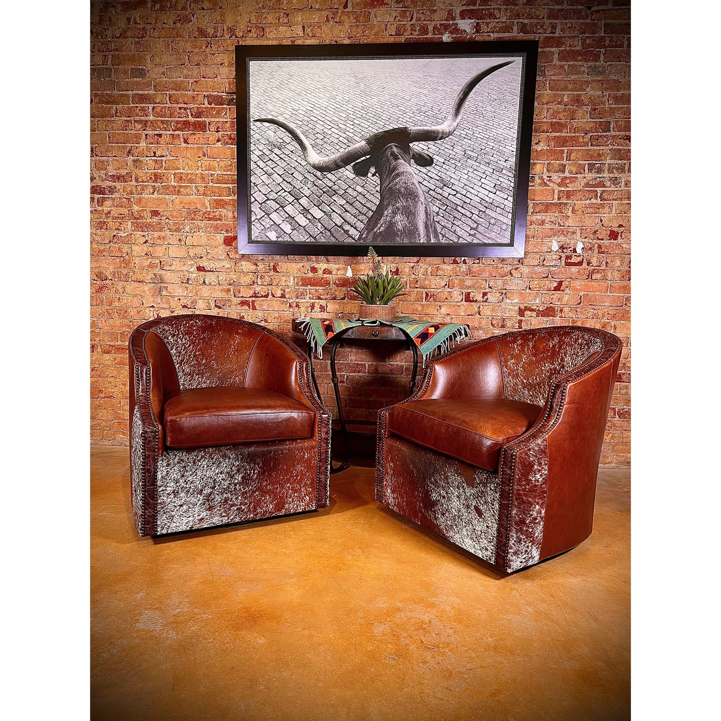 Experience ultimate comfort in style with the Longhorn Swivel Leather Barrel Chair. Made with top grain leather and hair on hide accents, this chair boasts a western flair with its nailhead trim and 360 degree swivel feature. Get ready to relax in extreme comfort and add a touch of rustic charm to your space!