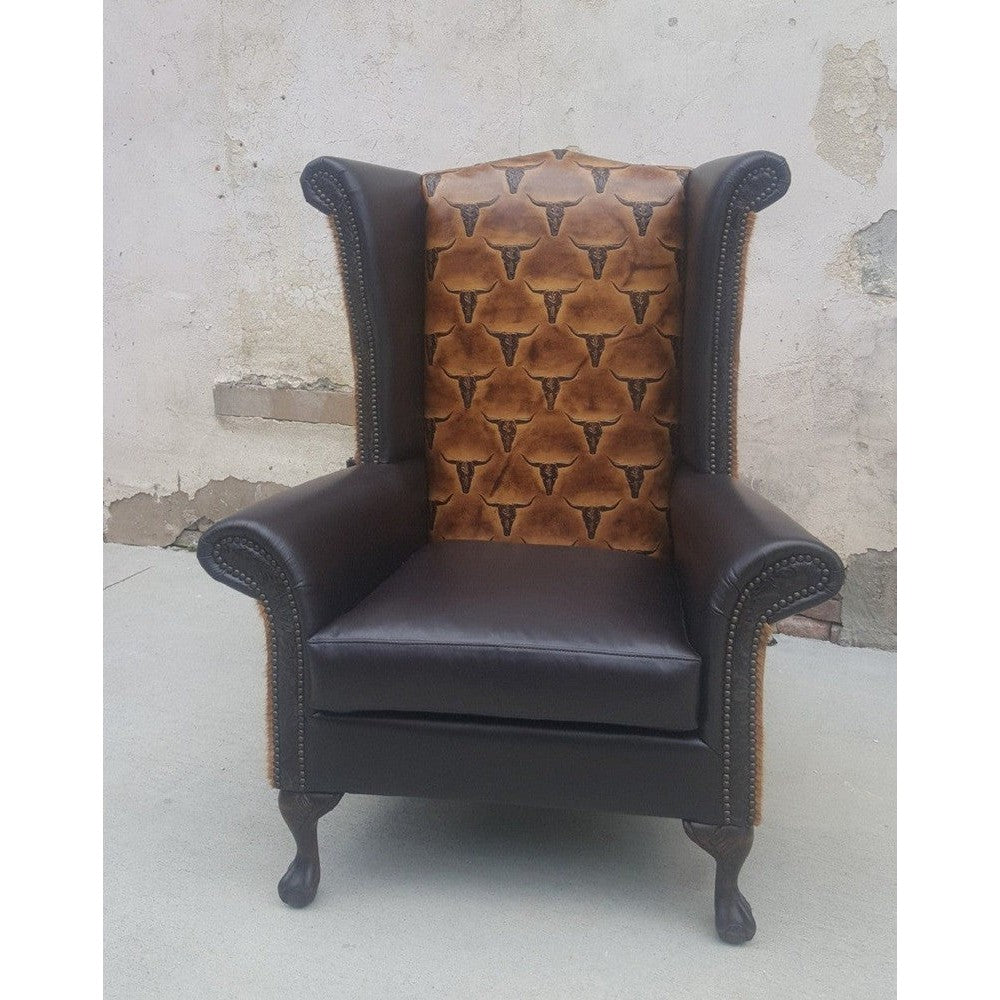 Bring rustic elegance into any space with this Longhorn Wingback Chair. Upgraded with top grain leather and stamped longhorn leather, it features rolled arms and a wingback silhouette for an impressive look. Comfortable and stylish, this chair will make any room shine.