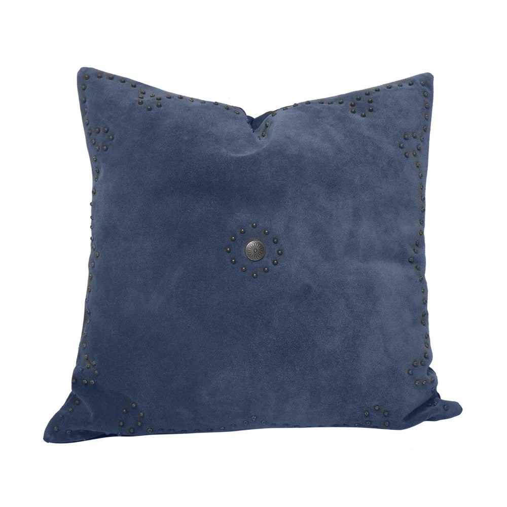 Classically crafted in suede, this Western Concho Pillow is perfect for any living space. Boasting a single silver concho center and a silver-studded border, its rustic elegance is available in four versatile shades: black, gray, navy, and tobacco. Add a luxurious touch to your the home with this timeless option.