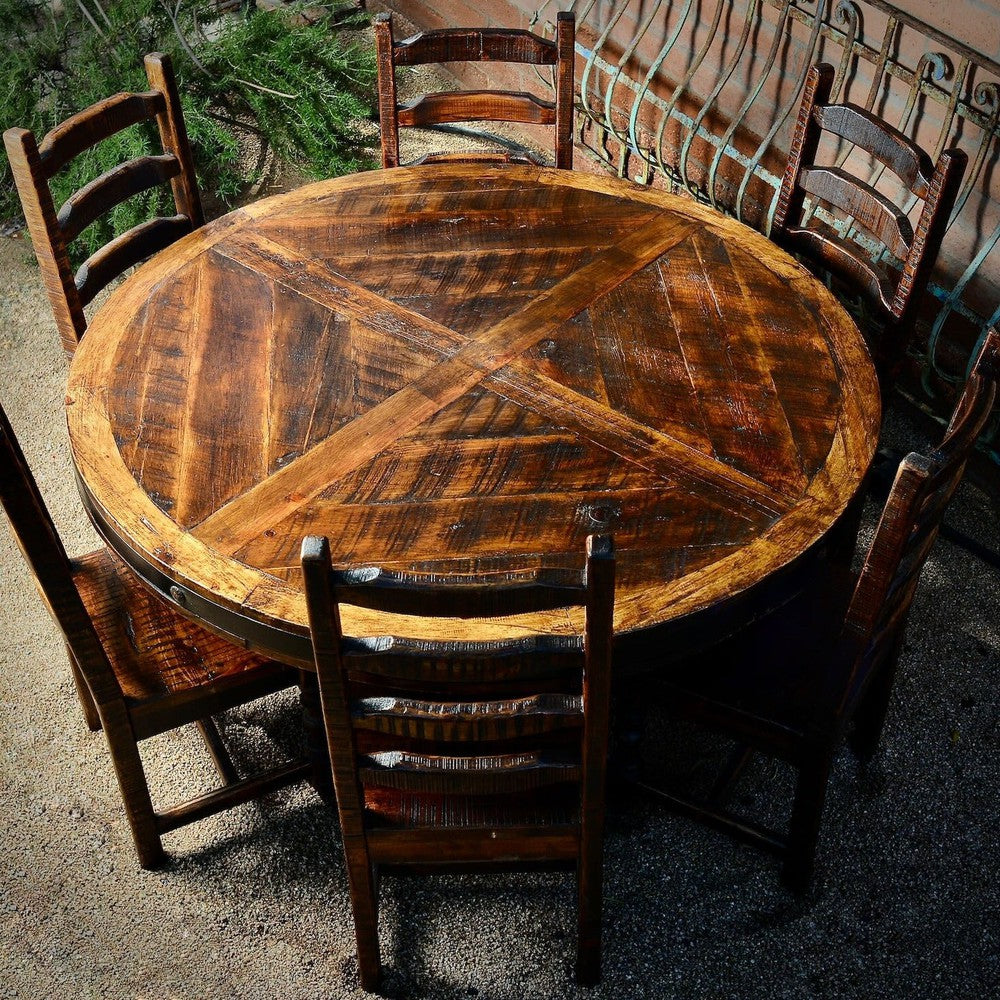 Add an unmistakable rustic elegance to your style with the Old Fashion Round Dining Table. Crafted from solid reclaimed wood and featuring a metal band with nailhead accents and a pedestal base, this handsome piece is designed to pair beautifully with any dining chairs. It's distressed finish complements its timeless, classic look.