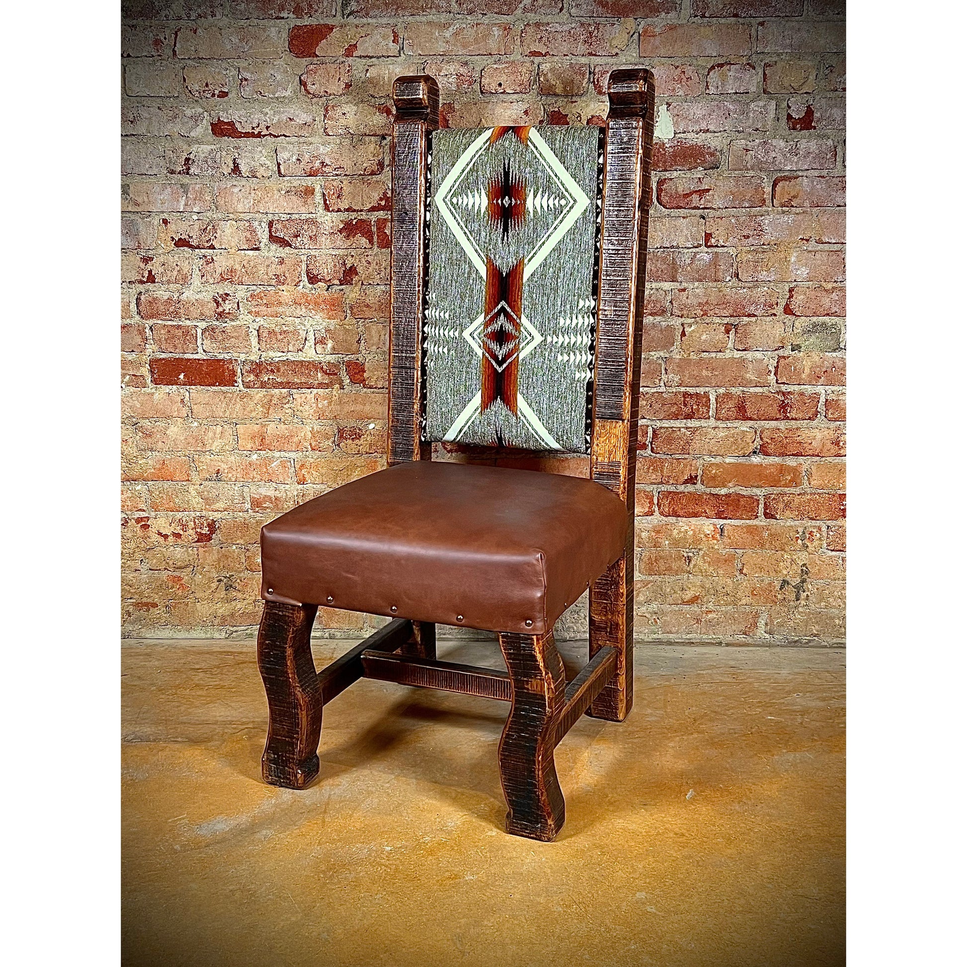 The Old Fashion Navajo Dining Chair adds rustic elegance to any home with its premium southwest upholstery and reclaimed wood construction. Enjoy its quality craftsmanship for a comfortable and unique seating experience.  Custom fabrics available.