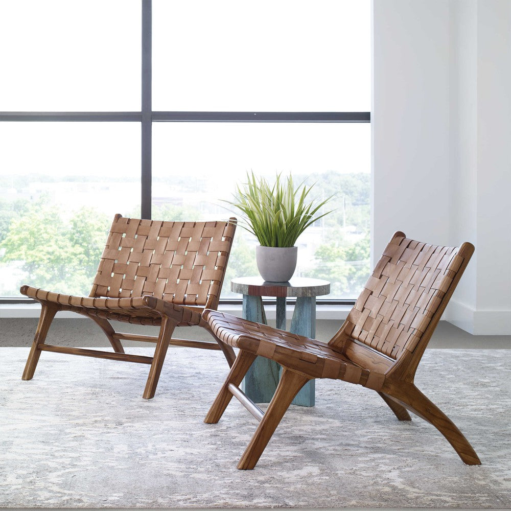 Our Plait Accent Chair is perfect for those looking to bring a mid-century modern flair to their home. Its sturdy teak wood frame, natural finish, and hand-woven cognac leather straps make a strong statement that is sure to enhance any living room. Its convenient 16" seat height makes it perfect for both short and tall users.