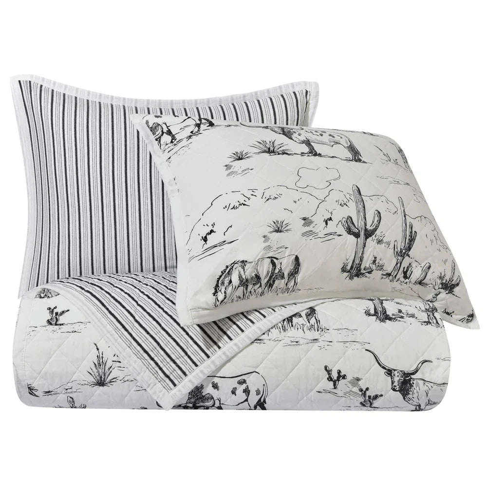 Explore the wild West with our Ranch Life Western Toile Quilt Set. Reversible and perfect for modern and traditional Western interiors, the quilt features a classic black-and-white toile design with ticking stripes for a timeless look.