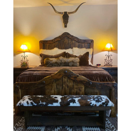 Sleep in style with the ultimate rustic-chic statement piece - the Rancho Bed. Crafted from durable reclaimed wood, this bed features an arched top with hammered nailhead accents for an authentic rustic look and feel. Perfect for adding a timeless touch to your bedroom.