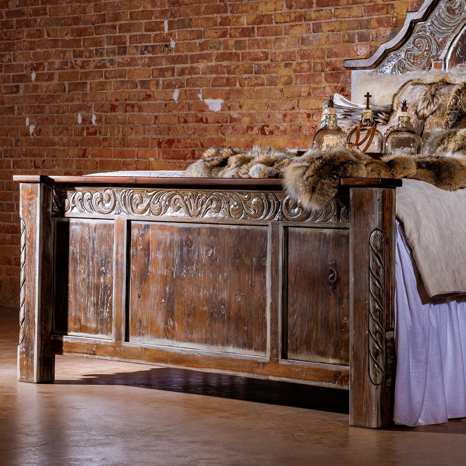 The Regency Wood Bed Frame adds a sophisticated, traditional, and rustic style to any bedroom. Crafted from hand-carved, reclaimed wood with a curved top and a hand-distressed cream wash, this classic piece of bedroom furniture is sure to elevate any room.
