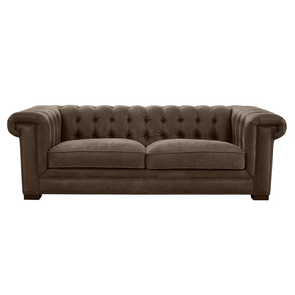 This luxurious Selleck Sofa features a sturdy hardwood frame, pocketed coil seating for comfort, panel key arm and button tufted design. Upholstered in supple top grain leather all over, its design is suitable for both western and contemporary decor. Experience sumptuous comfort with the Selleck Sofa.