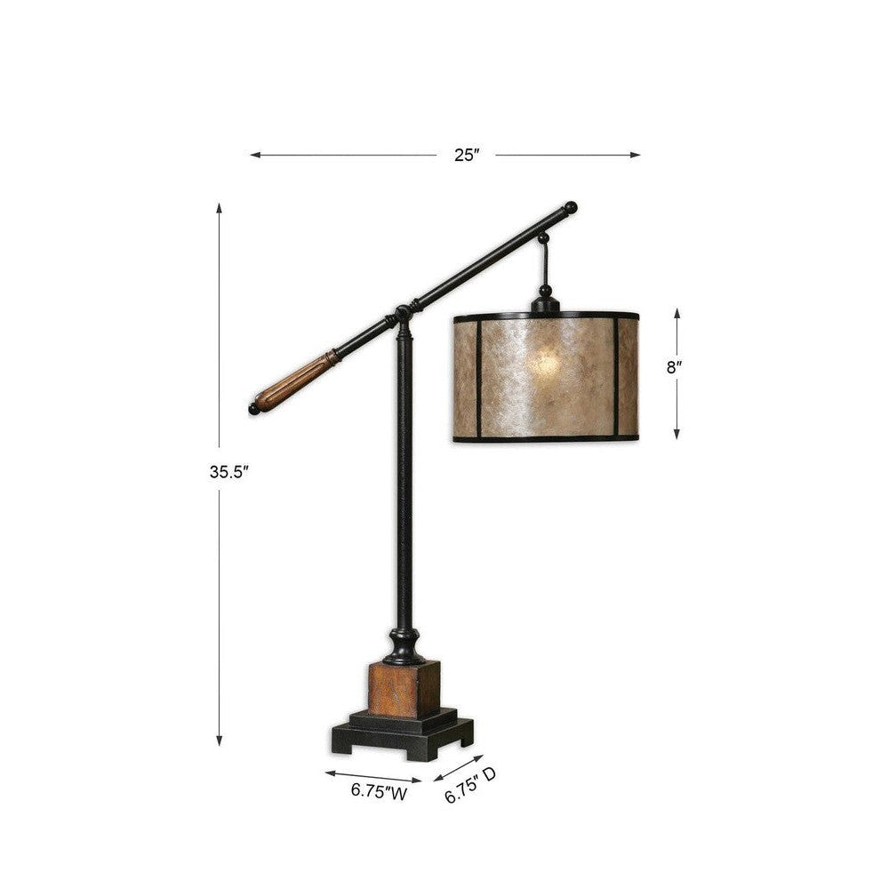 The Sitka Table Lamp features an aged black metal base accented with rustic mahogany and light rottenstone glaze solid wood details, plus a round drum shade of natural mica with aged black trim. This classic design is sure to lend a timeless look to any space.