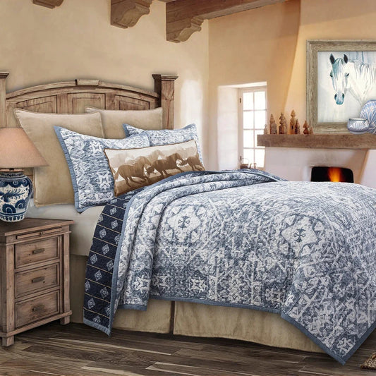 Gently mimic the natural pattern of ocean waves and bring a sense of serenity to your bedroom with the Skyler Quilt Set. Crafted using traditional shibori dyeing techniques to reflect the beauty of the sea, the ornate front reverses to a navy backdrop decorated with golden stripes and medallions. Create a coastal, rustic, or land-meets-sea look with neutral airy or taupe and tan accents.