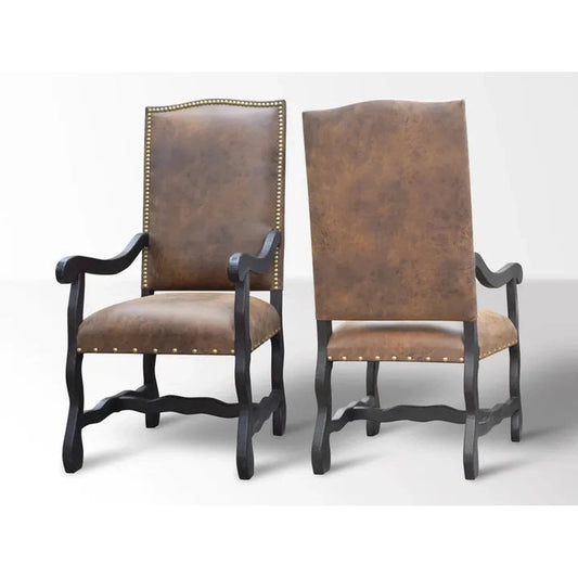 The Sonora Dining Chair is the perfect combination of comfort and style. Crafted with a solid wood frame and microfiber upholstery that looks like leather, it's easy to clean and maintain. Plus, it features a western-inspired design with nailhead accents and a distressed finish.