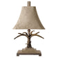 This Stag Horn Light Table Lamp is the perfect balance of modern and traditional aesthetics with its natural brown and ivory finish, scratched silver and cast aluminum accents, and a brushed palomino sueded shade with clipped corners. An ideal addition to any room.