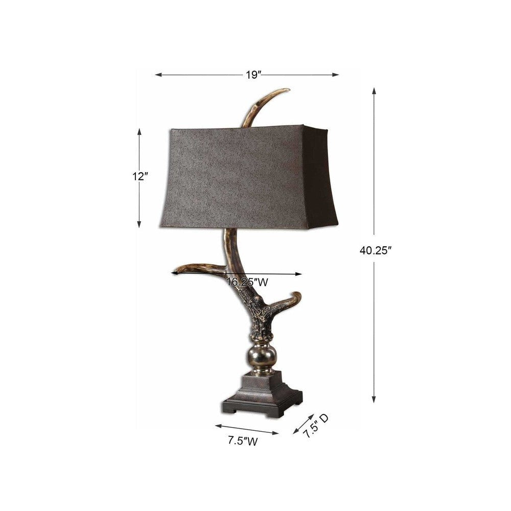 Elevate your home decor with the Stag Horn Table Lamp. Crafted with a burnished bone ivory finish, wood tone base and cast aluminum accents, this lamp is a beautiful addition to any room. The rectangle semi drum shade has a luxurious sueded chocolate fabric for a touch of sophistication.