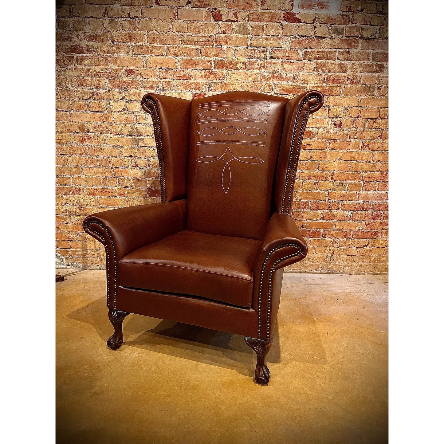 Step up your interior design game with the Stetson Wingback Chair. Crafted with a distinctive boot stitch and elegant wingback design, this chair exudes rustic charm. Elevate your space with a touch of sophistication and comfort.