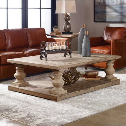 This Stratford Coffee Table is made from salvaged lumber and hand turned balusters, producing a solid construction. It is finished with a stony gray wash and has a sun faded, distressed patina for a unique and traditional look. The solid wood will also adjust to temperature and humidity changes, creating small cracks and an uneven surface adding character and authenticity.