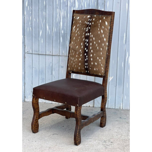 Experience luxury and elegance with the Tejas Dining Chair. This chair features a solid wood frame, top grain leather seat, and axis hide for a sophisticated look. From its high-end materials to its stunning Western-inspired design, this chair makes a stylish statement in any dining room.