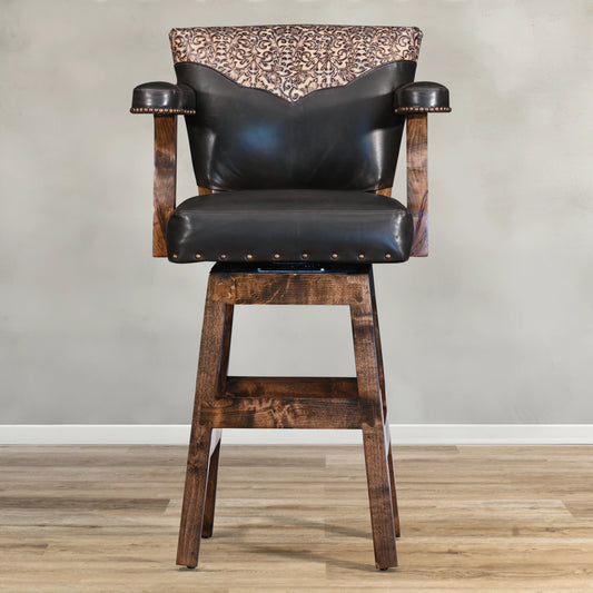 Introducing the Tooled Yoke Chisum Barstool, crafted with top grain leather for beauty and comfort. Accent nails add a touch of sophistication, while the tooled leather yoke exudes classic style. Upgrade your seating with this elegant and comfortable barstool.