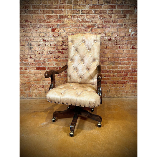 This cream floral leather tufted office chair is a stylish addition to any workspace. Made with top grain leather and featuring an embossed floral leather on the outside back, this chair is both comfortable and elegant. The added nailhead trim and swivel feature make it a versatile and functional choice.