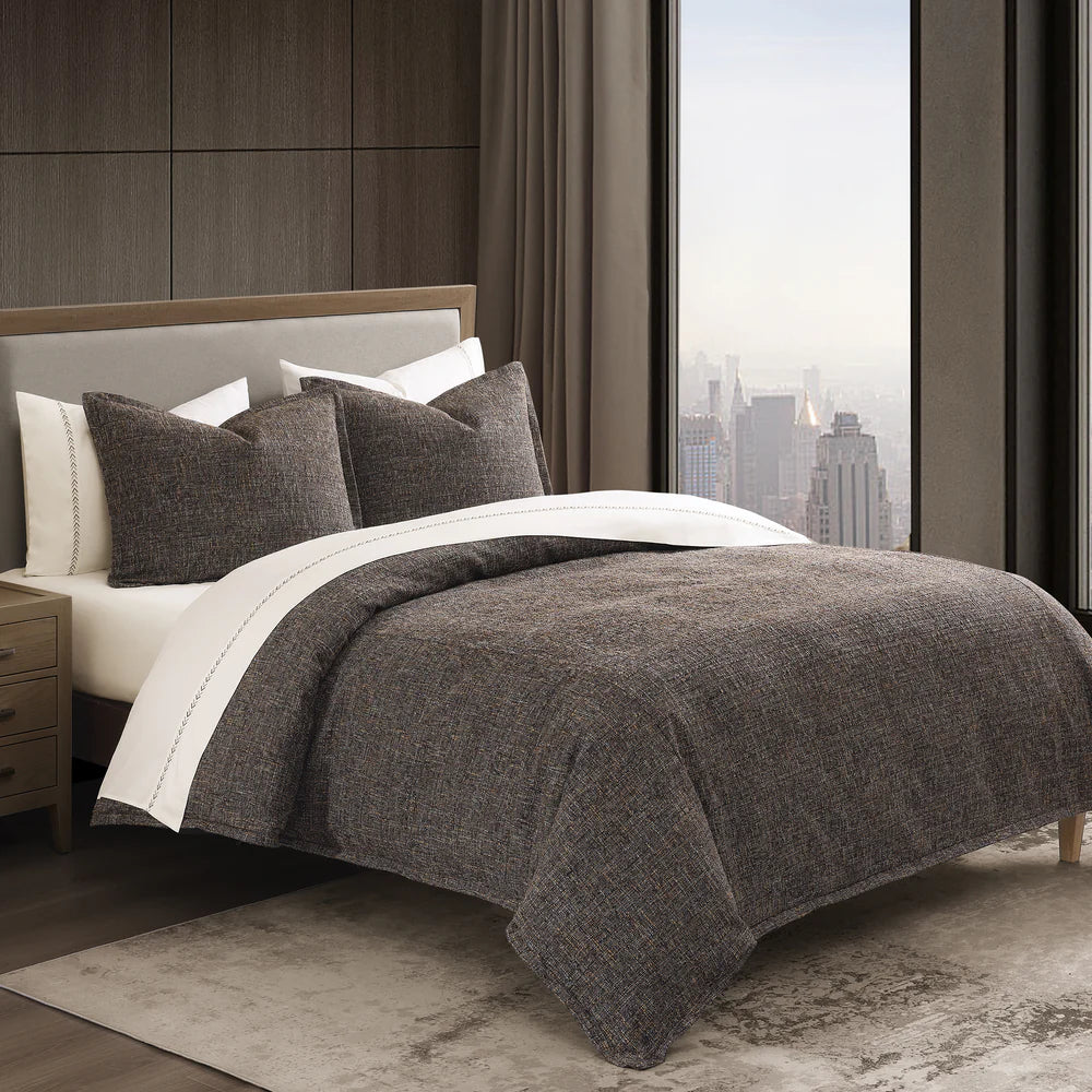 Dress your space to the nines with the sophistication of classic menswear suits with our Tweed Comforter Set. Pulling colors and textures from time-tested fashion, this textured tweed bedding is woven from multi-colored boucle yarns—specially spun for this collection. The tweed boucle fabric’s dense construction imparts a comforting weight, providing extra warmth and a coziness that makes you want to curl up under the thick comforter.