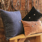 Classically crafted in suede, this Western Concho Pillow is perfect for any living space. Boasting a single silver concho center and a silver-studded border, its rustic elegance is available in four versatile shades: black, gray, navy, and tobacco. Add a luxurious touch to your the home with this timeless option.