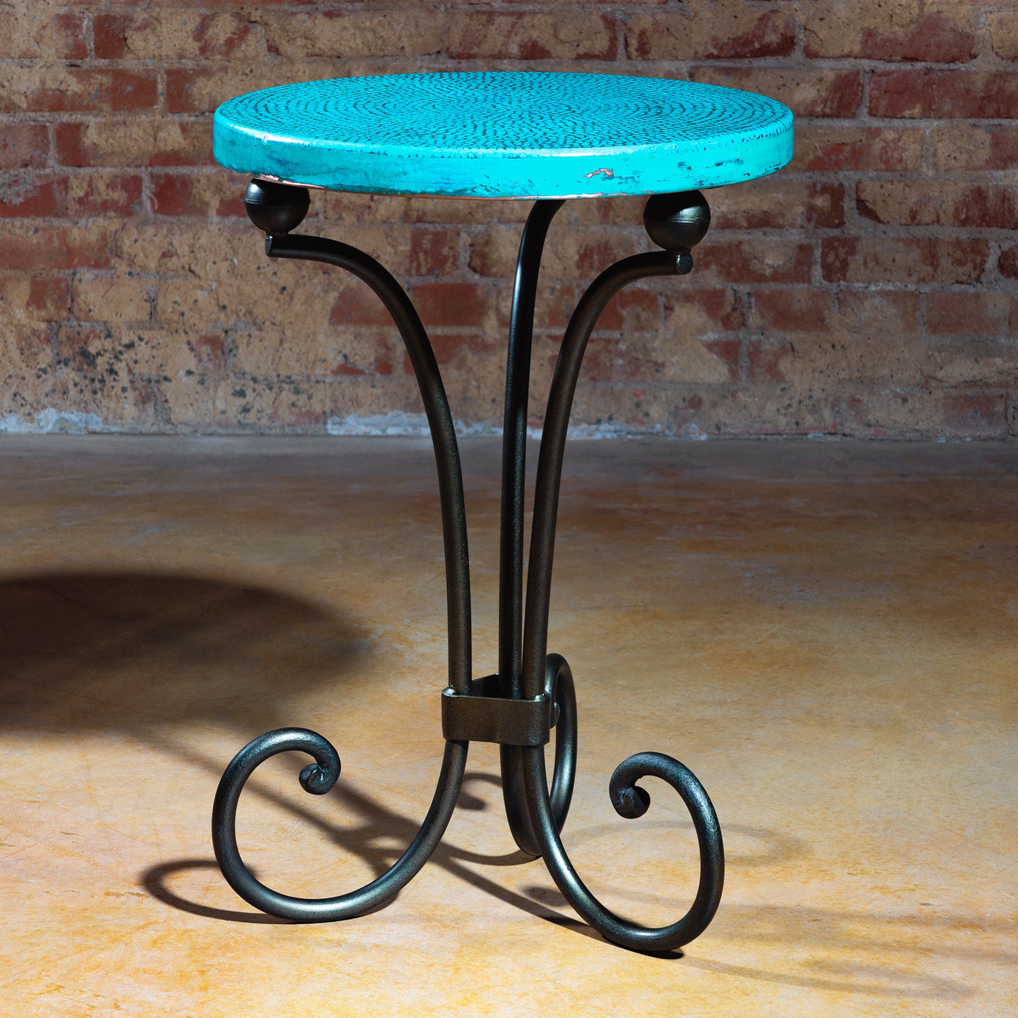 Hero image of The Azul Mesa Accent Table featuring turquoise hammered copper top and wrought iron legs