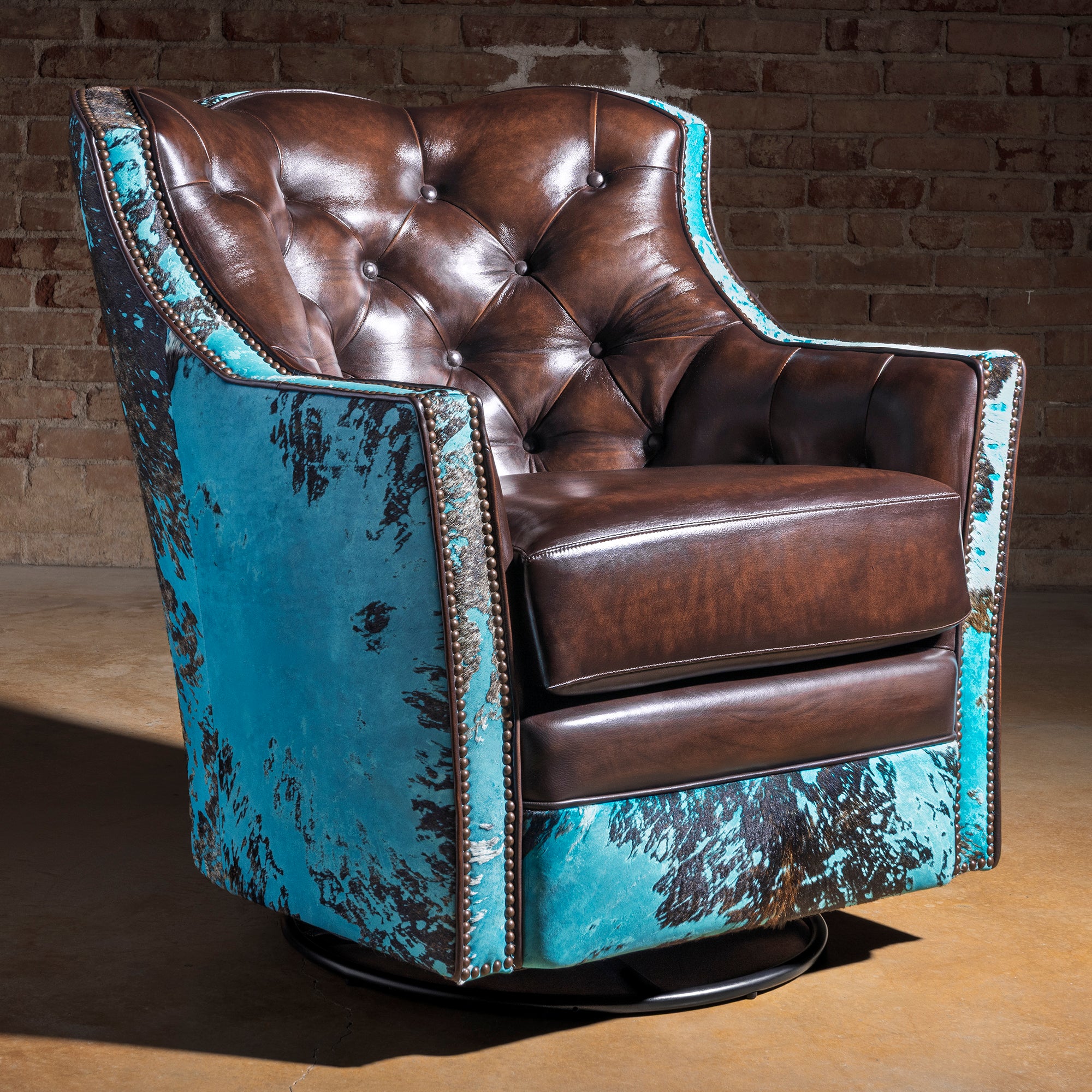 Azure Spur Tufted Western Swivel Chair western swivel chair with turquoise cowhide exterior, tufted leather back, and deep lounge seat.