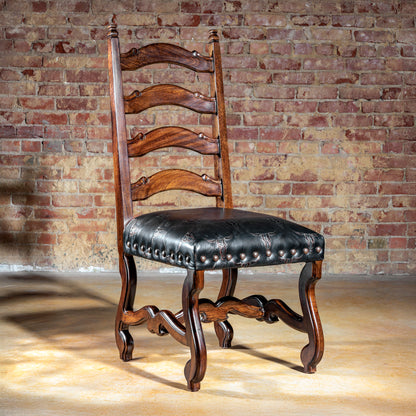 Ladderback Western dining chair with embossed black leather seat and hand-carved wood frame