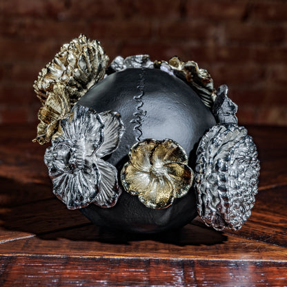 Rear view of skull showing floral embellishments and stitched seam texture