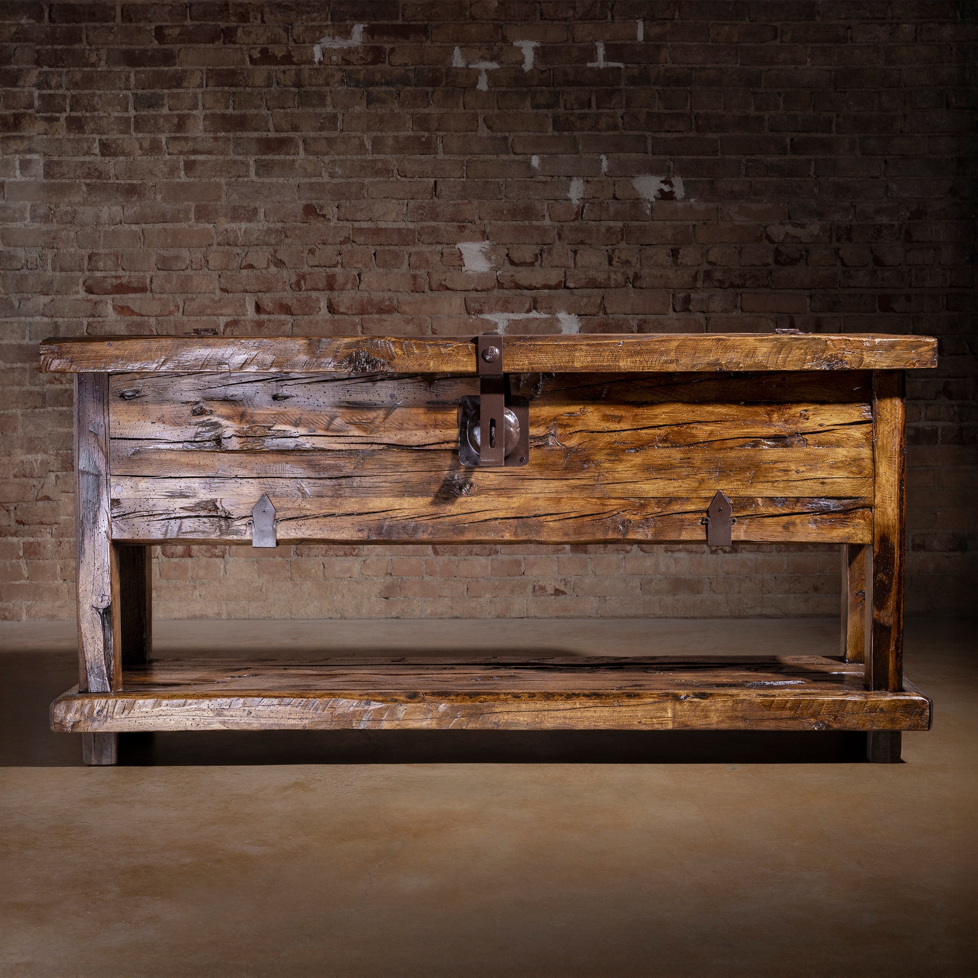 Bosque Timber Vault front view showing aged reclaimed wood, iron latch, and lower storage shelf