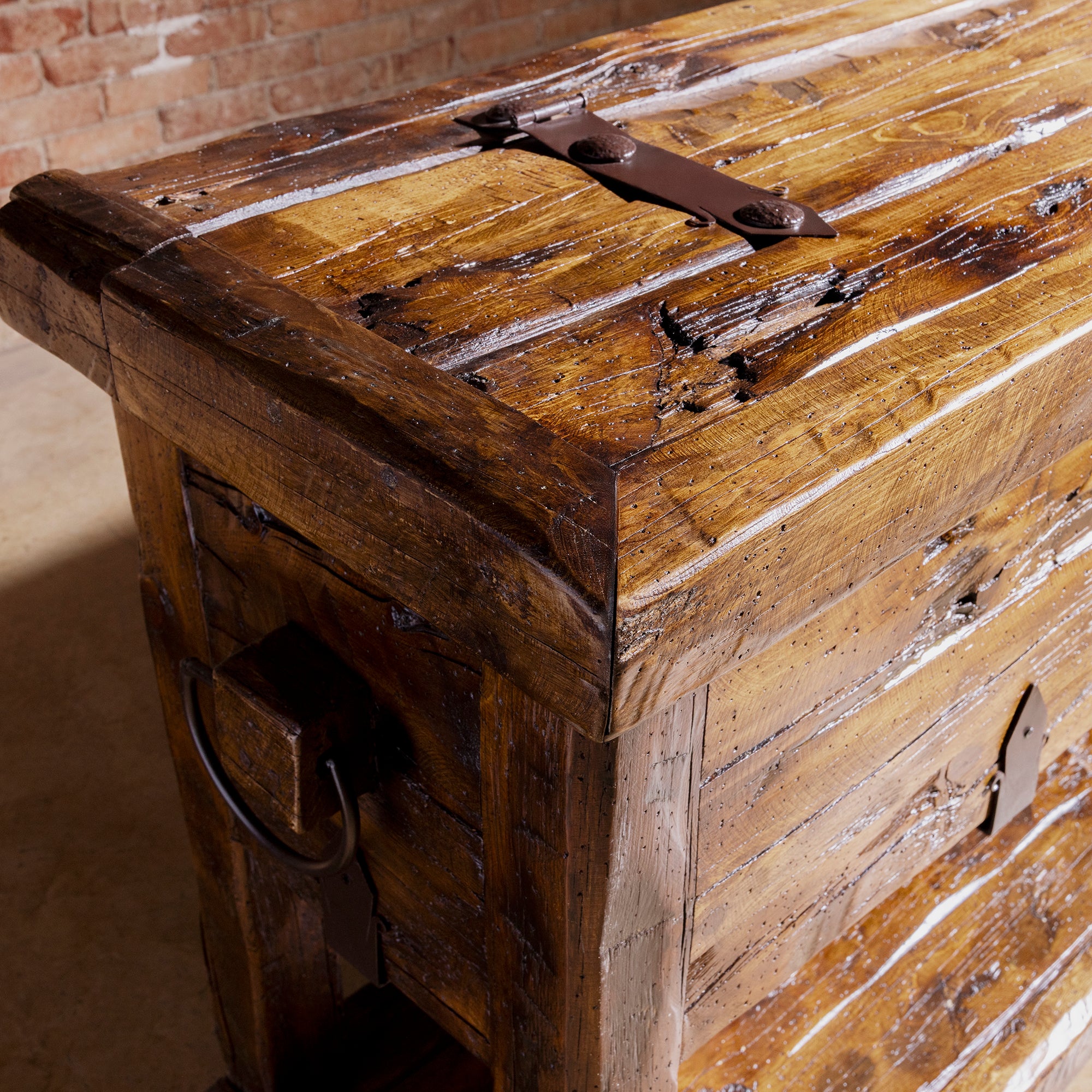 Bosque Timber Vault top corner detail with aged reclaimed planks and dark iron strap hardware