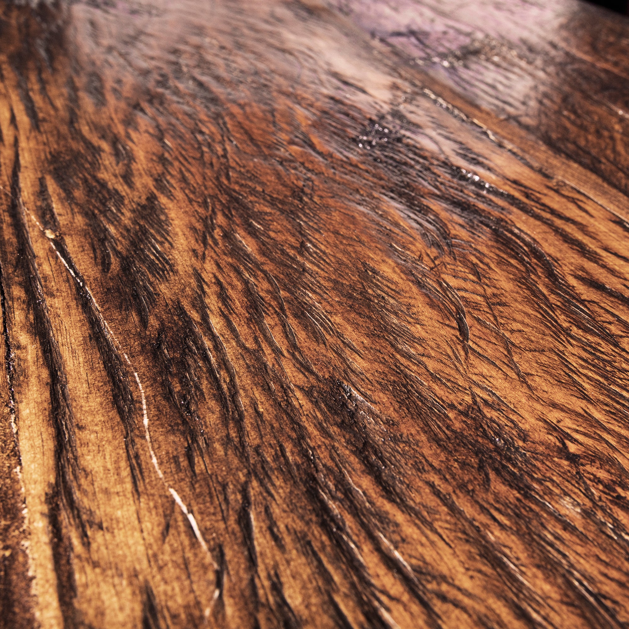 Close-up of reclaimed wood grain texture on Brazos carved Western sideboard