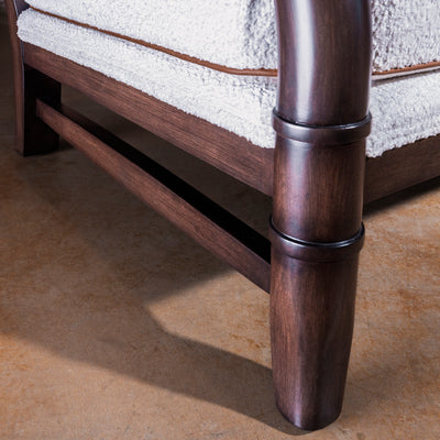 Closeup of wood leg and stretcher detail on Briarwood Western accent chair