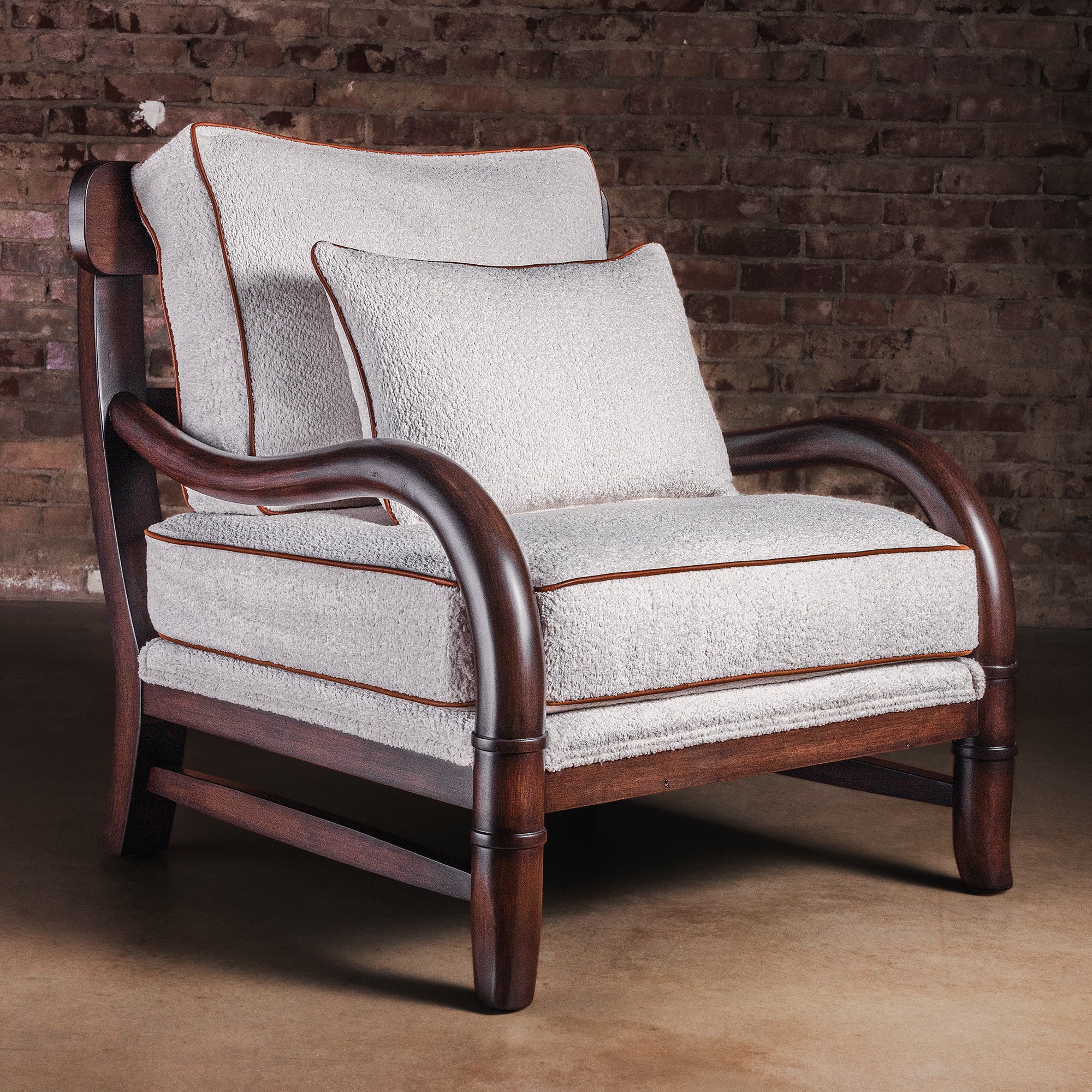 Briarwood bouclé lounge chair with wood frame and leather piping, full view