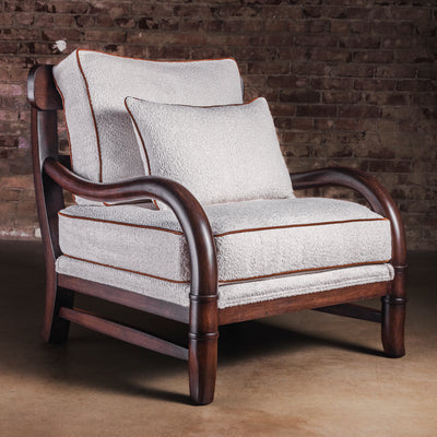 Briarwood bouclé lounge chair with wood frame and leather piping, full view