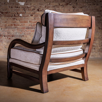 Back view of Briarwood Western bouclé accent chair showing sculpted wood frame