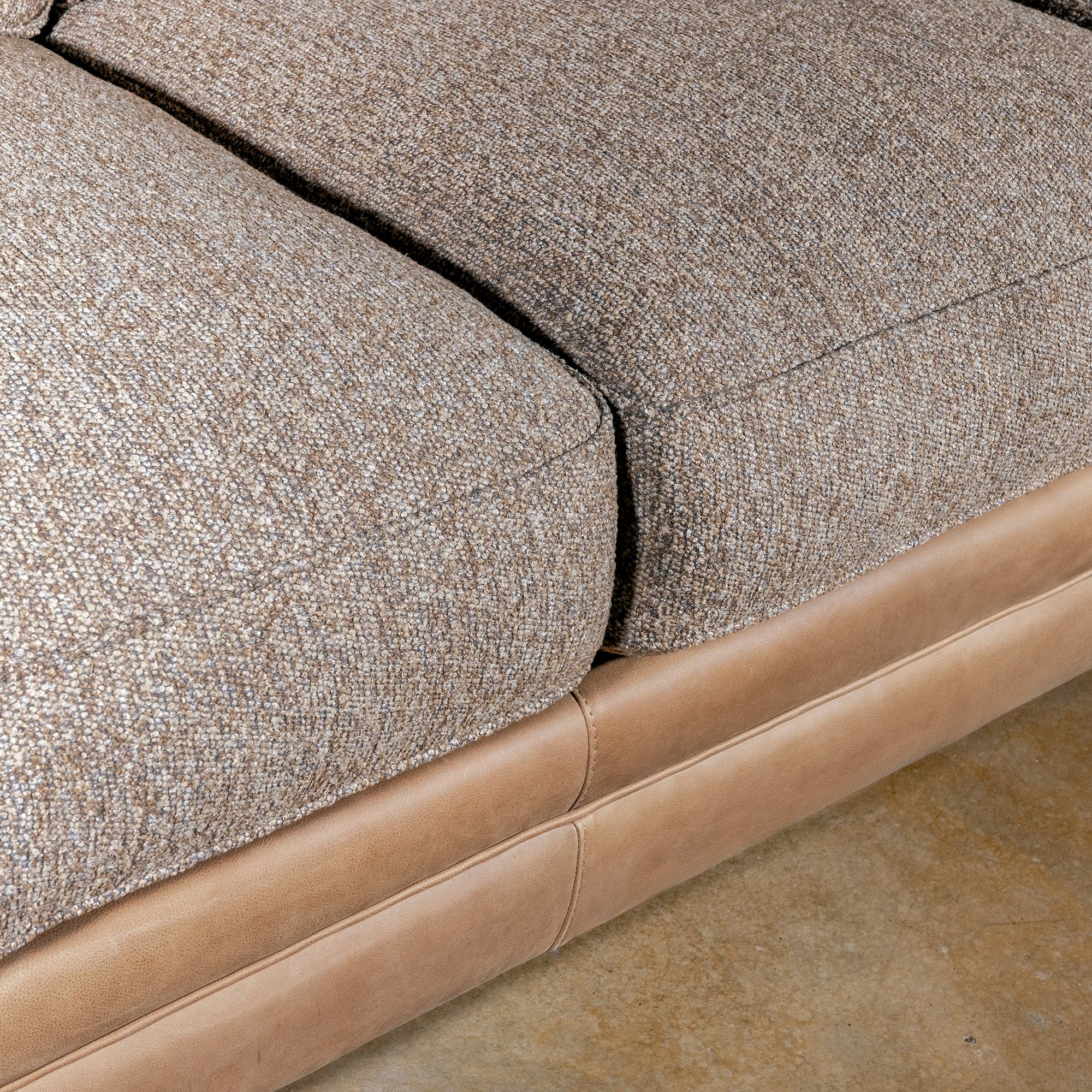 Bridger Nailhead Sofa western sofa seat detail with woven cushions, saddle leather base, and tailored Western texture