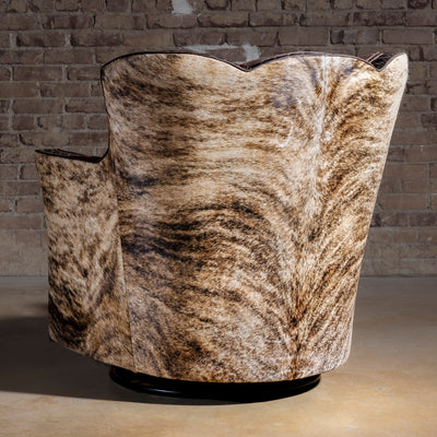 Brindle Cavalier Cowhide Western Swivel Chair rear view with full Brazilian cowhide wrap, sculpted wingback, and 360-degree base.