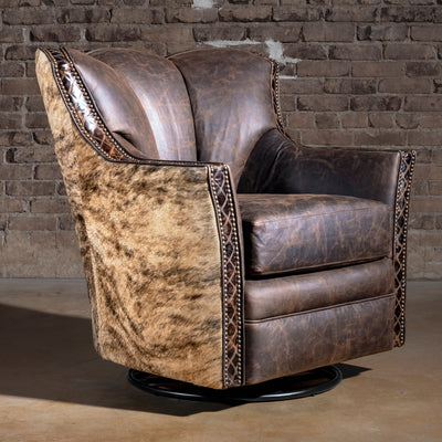 Brindle Cavalier Cowhide Western Swivel Chair front view with high wingback, top-grain leather seat, cowhide sides, and swivel base.