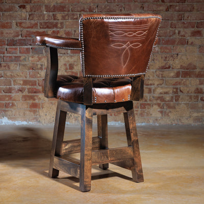 Close-up of boot stitch embroidery detail on the back of a brown Western leather bar stool