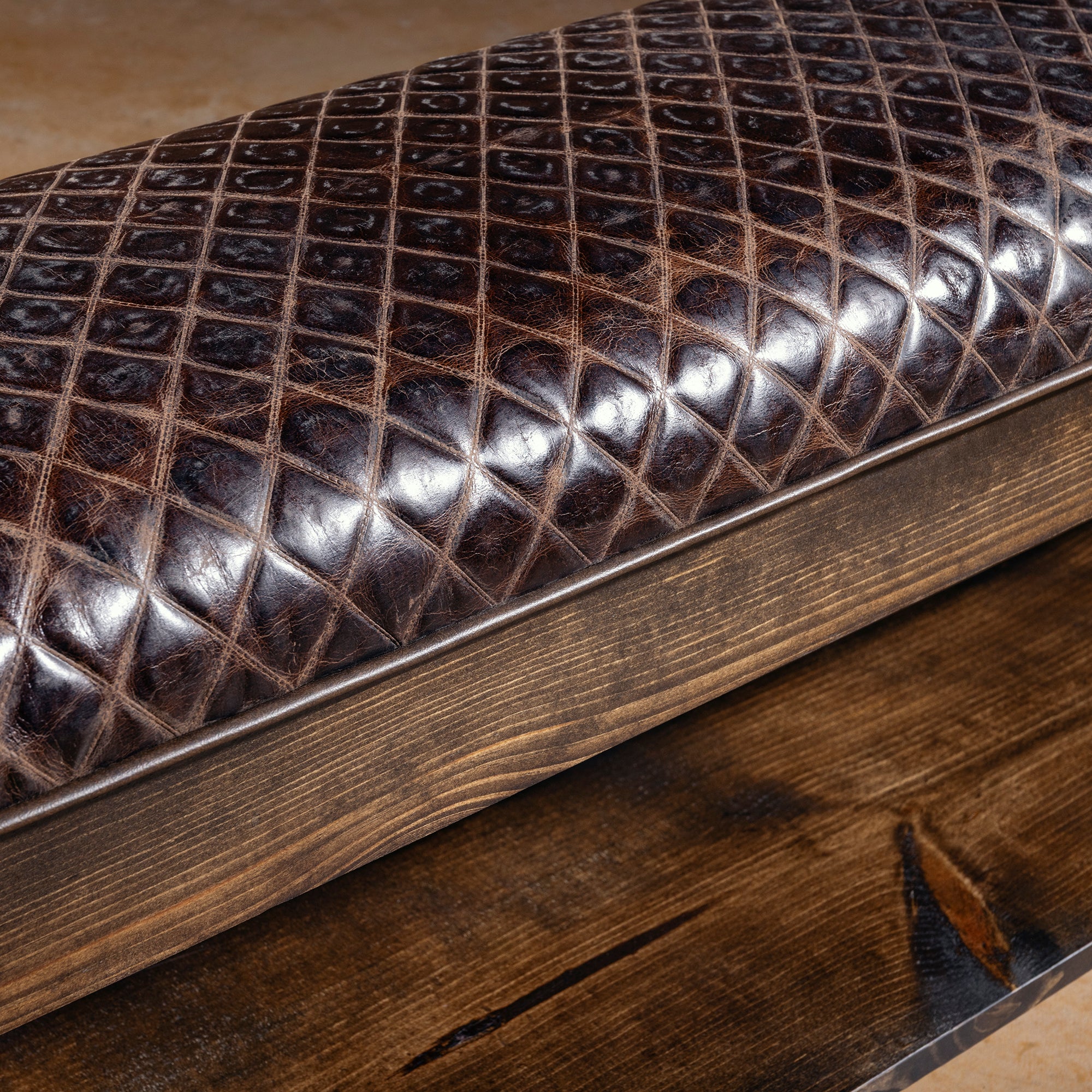 Close-up of embossed Western leather upholstery on Iron River Bench
