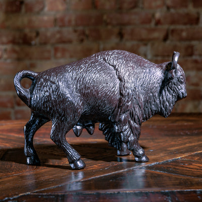Opposite angle of cast bison with sculpted muscle and tail