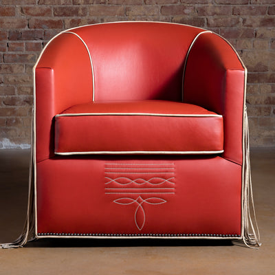 Front view of coral-red leather swivel chair with bootstitch detail and tailored piping
