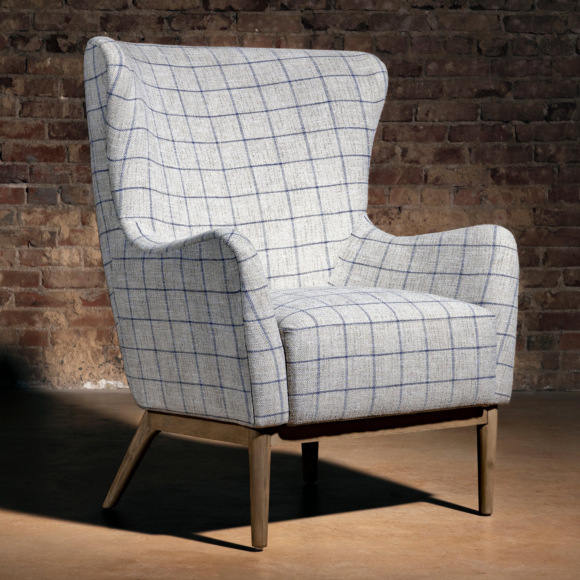 Canyon Plaid Fireside Chair in windowpane fabric with wood legs, western lodge accent chair for ranch living room